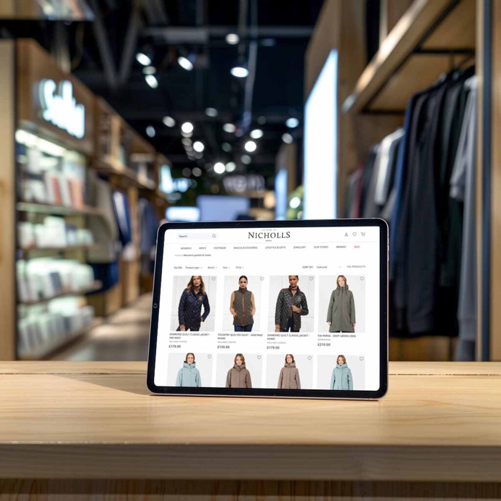 Nicholls ecommerce site displaying fashion products on an iPad