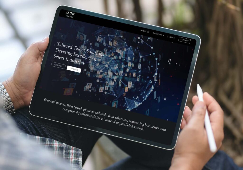 Ikon-Search a New York based recruitment agency, website development shown on tablet in hand