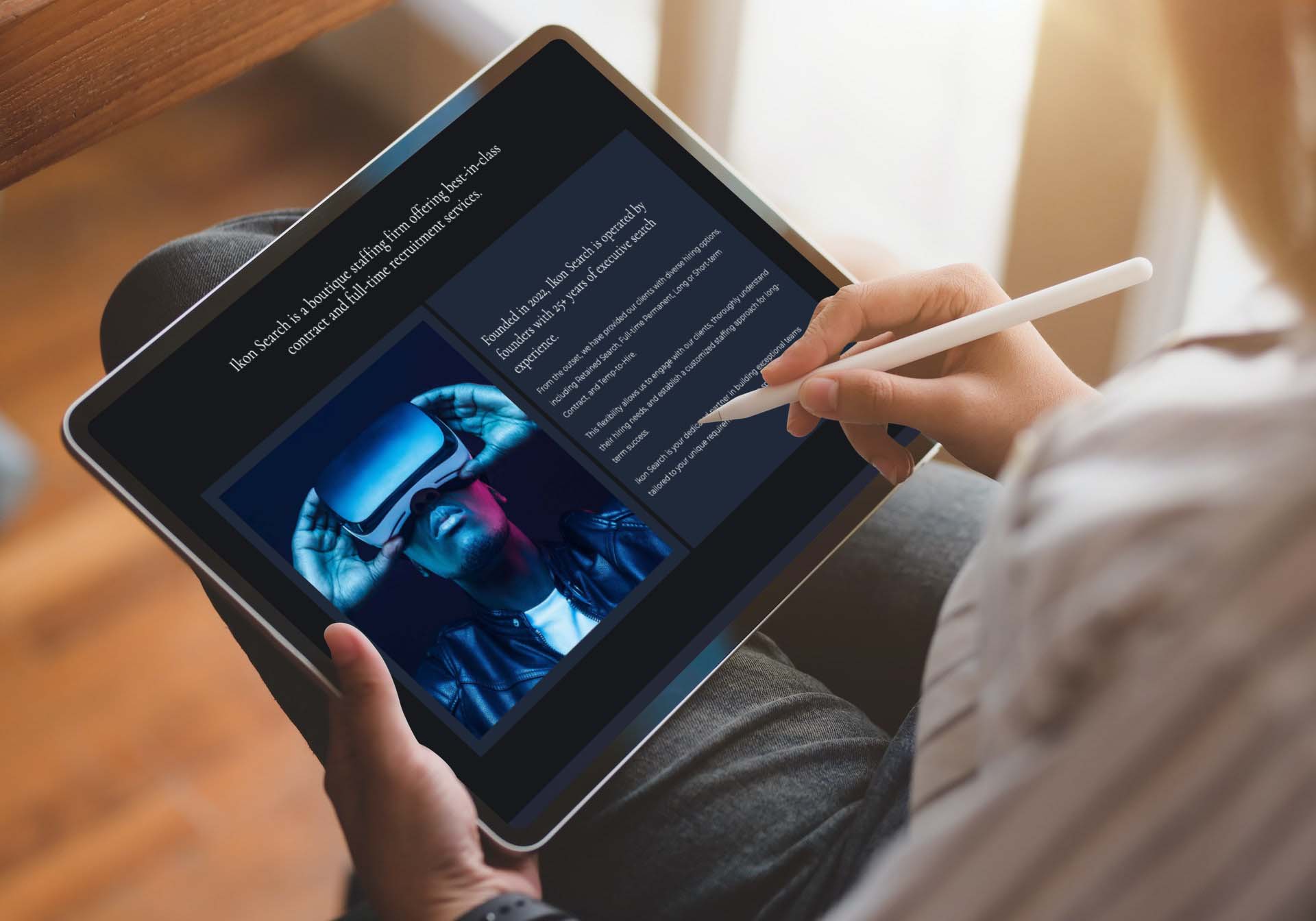 Ikon-Search a New York based recruitment agency, website development shown on tablet in hand